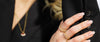 Close-up of Loretana 14K gold rings stack on model hand with bracelet, sizing reference for hoops and rings. Hallmarked 925 silver core, Kaunas.
