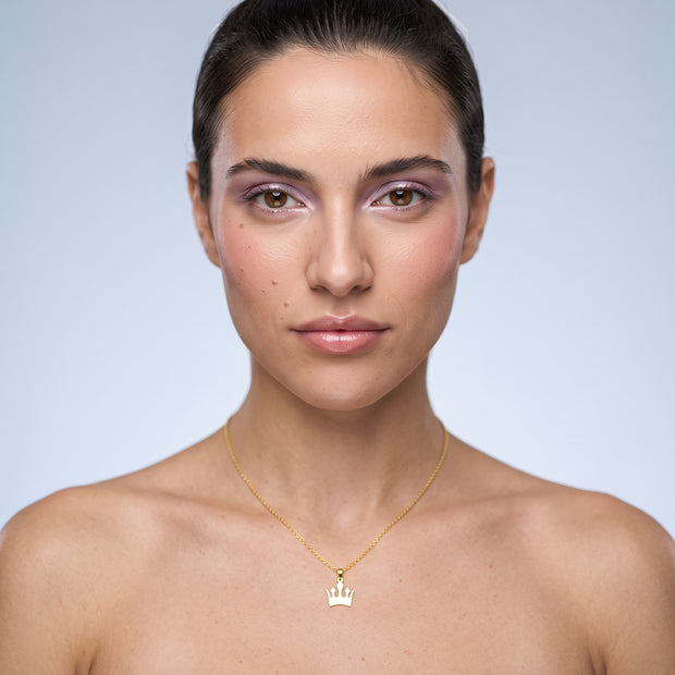 Model wearing the Crown Pendant Necklace in 18K gold-plated 925 sterling silver