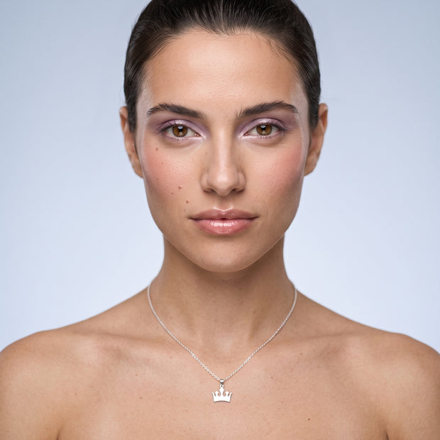 Model wearing the Crown Pendant Necklace in 925 sterling silver