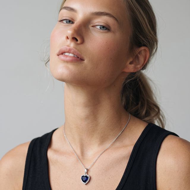 Model wearing the Blue CZ Heart Necklace in 925 sterling silver