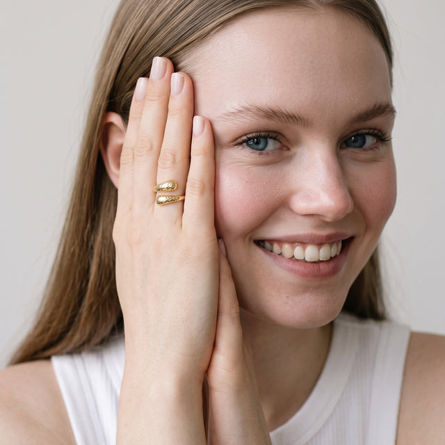 Model wearing the Hammered Teardrop Ring in 14K gold-plated 925 sterling silver