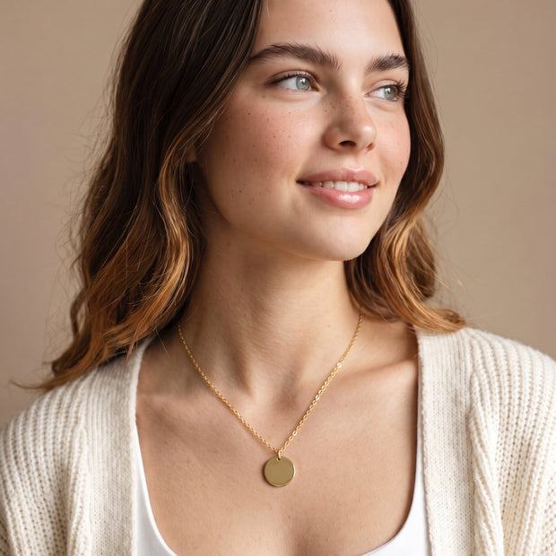 Model wearing the Engraved Coin Necklace in 14K gold-plated 925 sterling silver on a cable chain